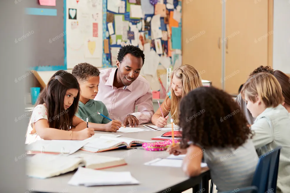 Teacher and students in a classroom working together at a table