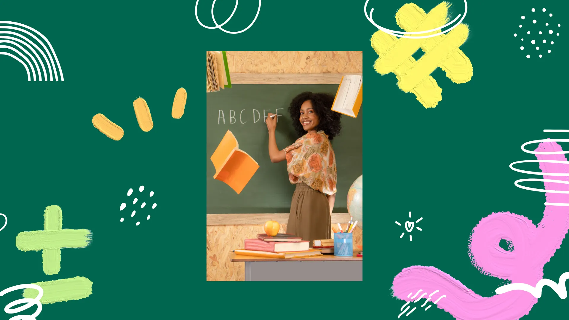 A person writing the alphabet on a chalkboard in a classroom