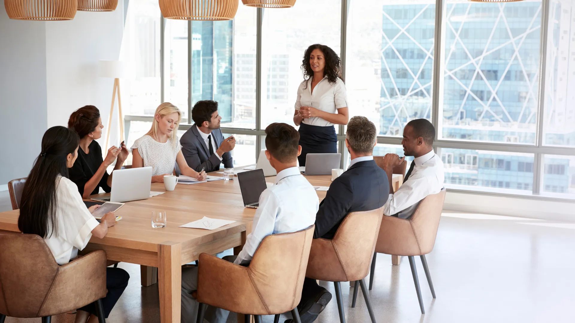 A group of people in a modern conference room having a meeting