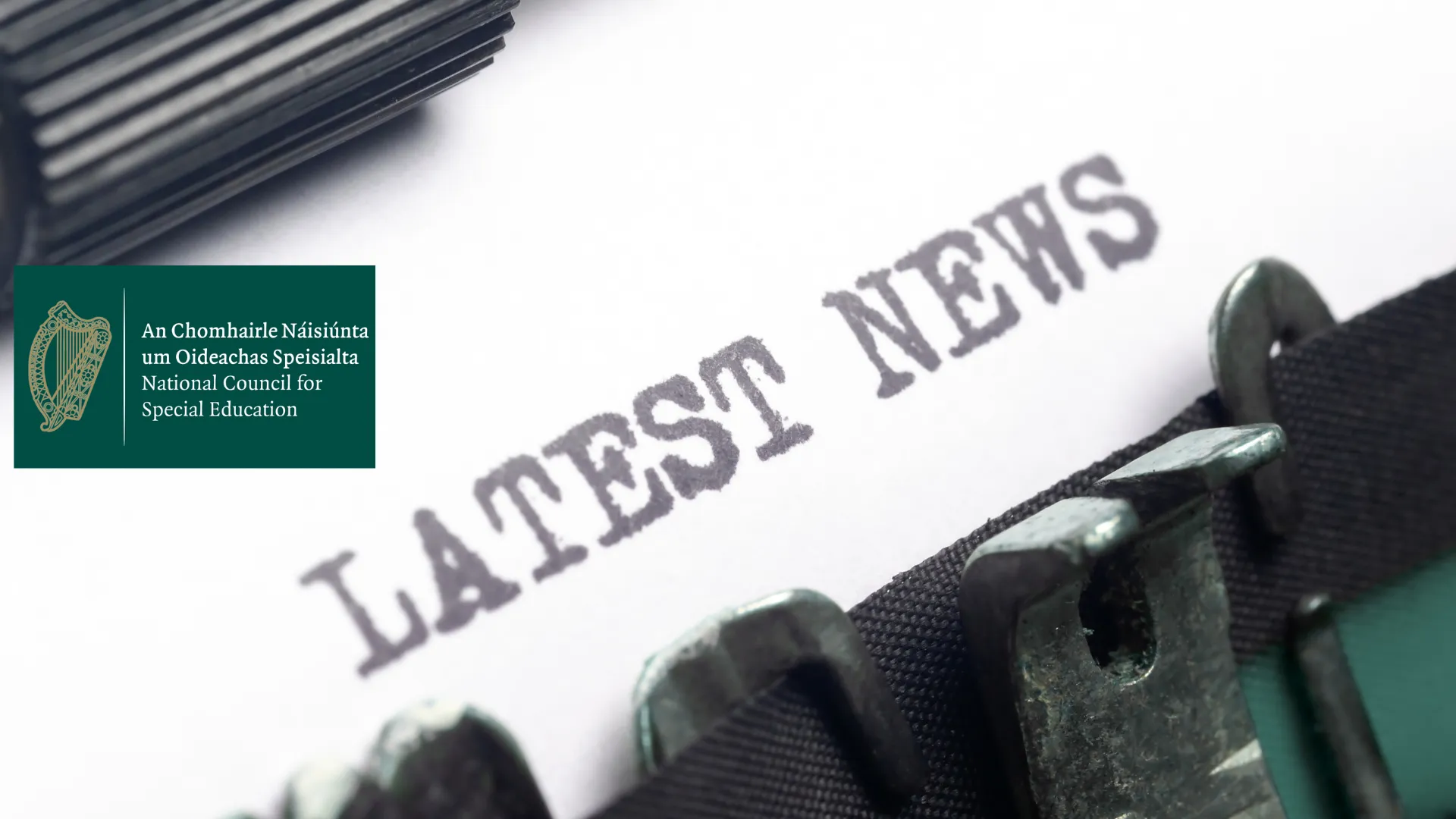 Typewriter with sheet in with the words "Latest News" typed with the logo and text of the National Council for Special Education in Ireland