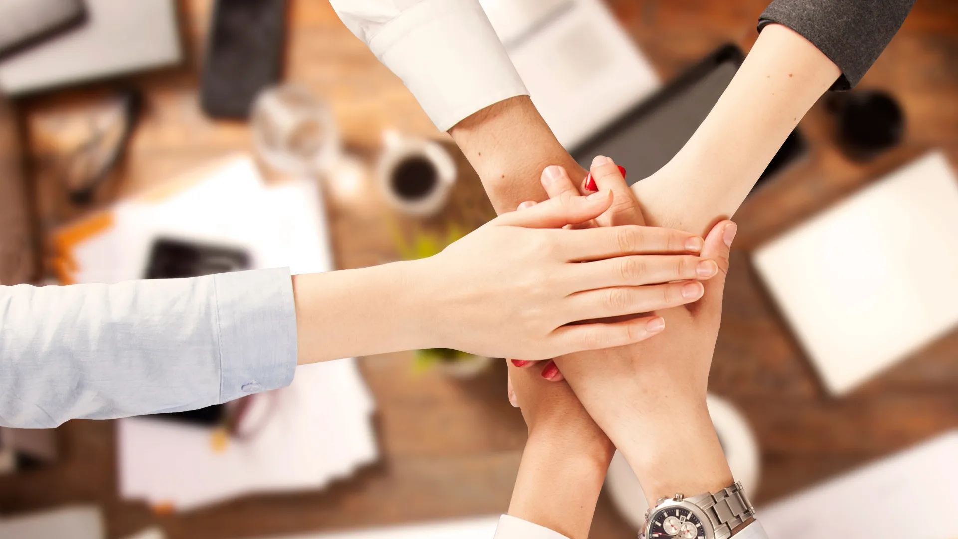 A group of hands placed on top of each other