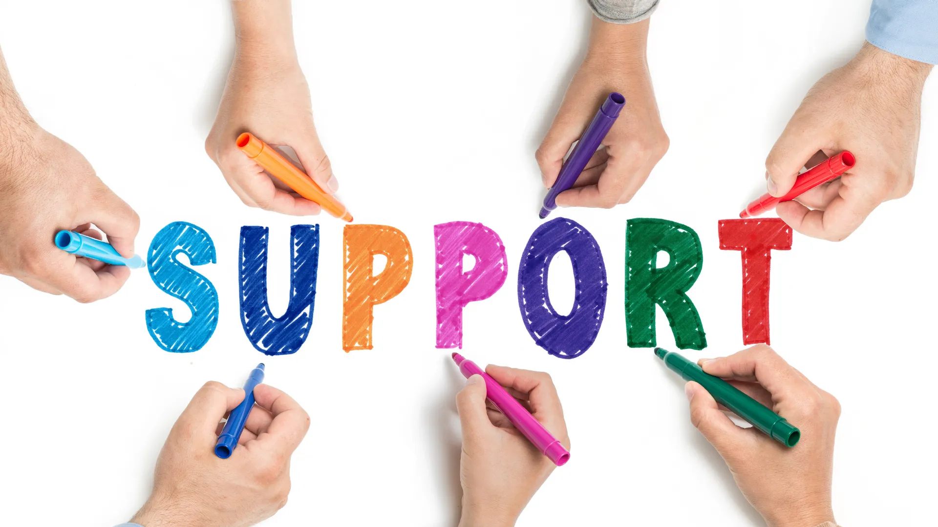 Multiple hands holding colourful markers, writing the word 'SUPPORT'