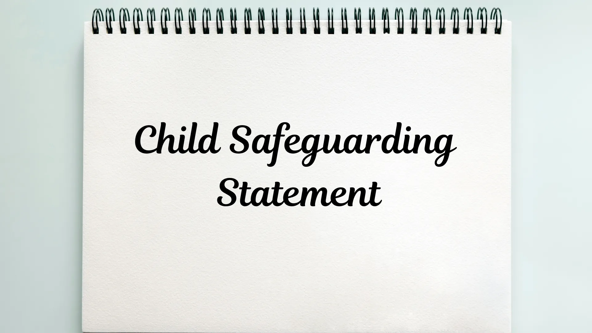 "Child Safeguarding Statement written on a notepad."