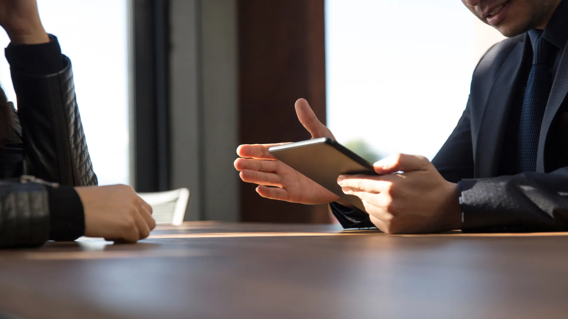 Two members of a consultative forum having a discussion