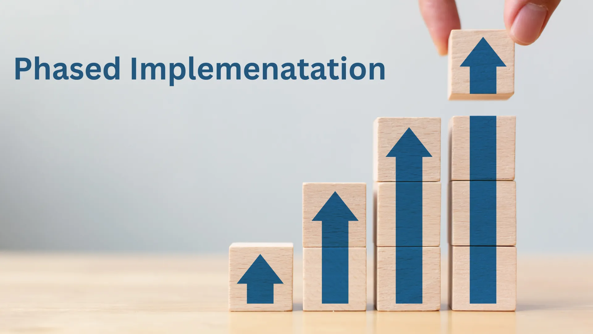 Stacked blocks with arrows showing phased implementation